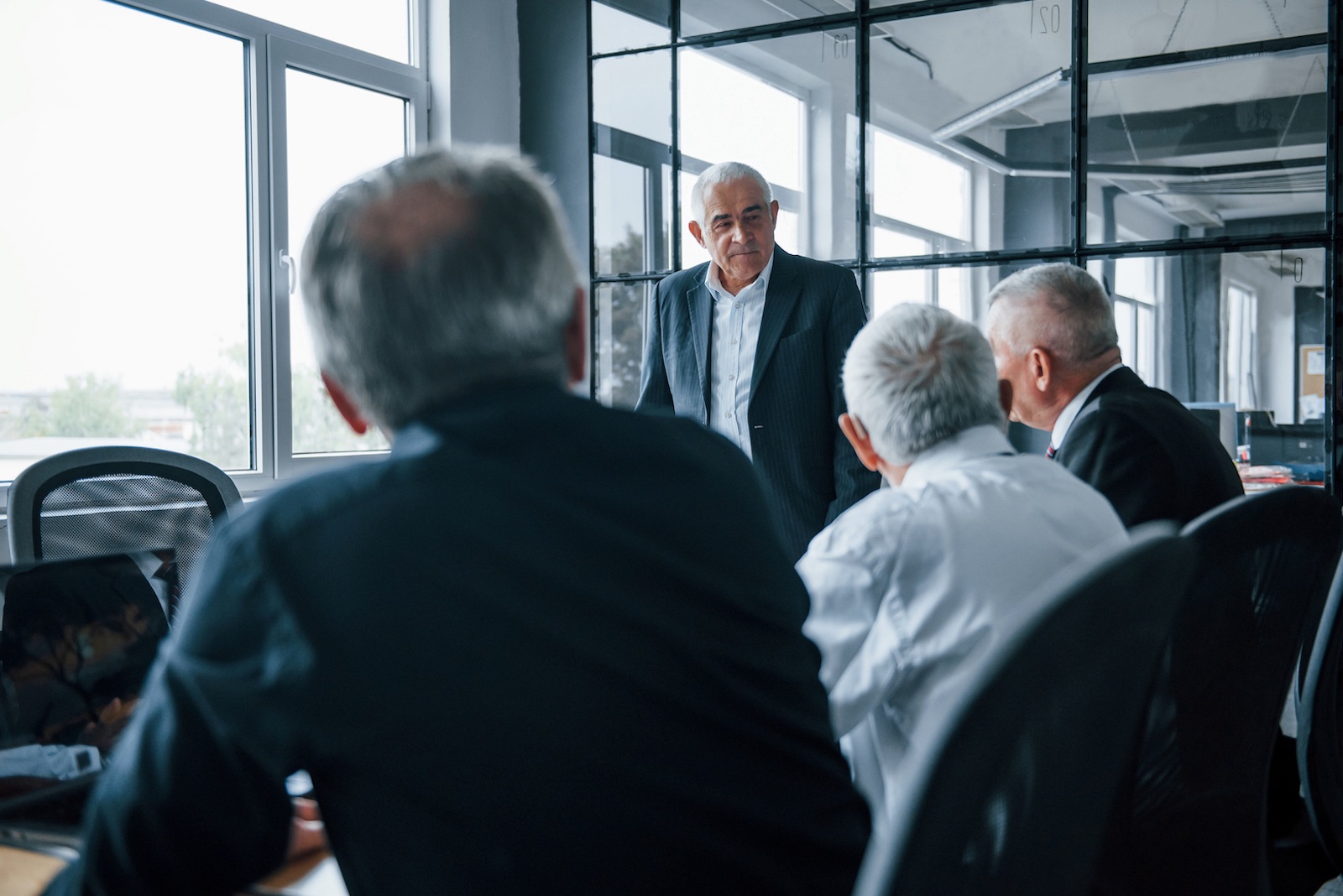 Group of Investors meeting in an office